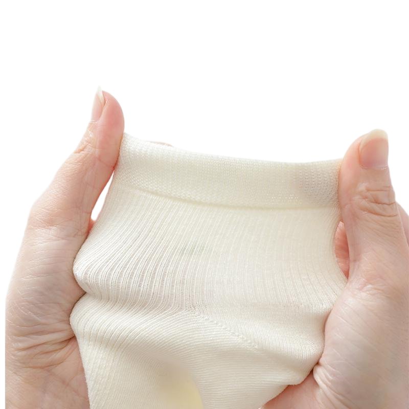 Women's ramie sock cuff stretched to show the knit and elasticity